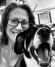 black and white photo of Lori LeComte and her dog